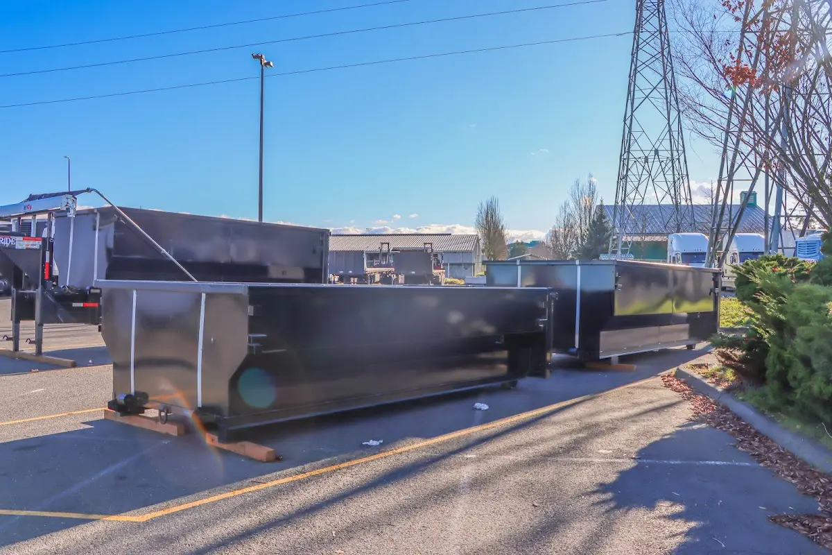 Roll-off dumpster ready for waste disposal at job site for Concrete Dumpster Rental in Rochelle